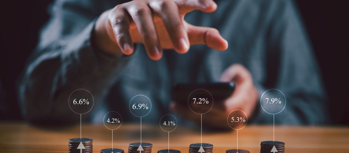 Investor, investment, fund, trader, stock market, businessman stacking coins different height with percentage for interest rating from differ investment, Financial profit return and dividend concept.